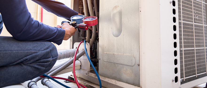 HVAC Tech checking Refrigerant