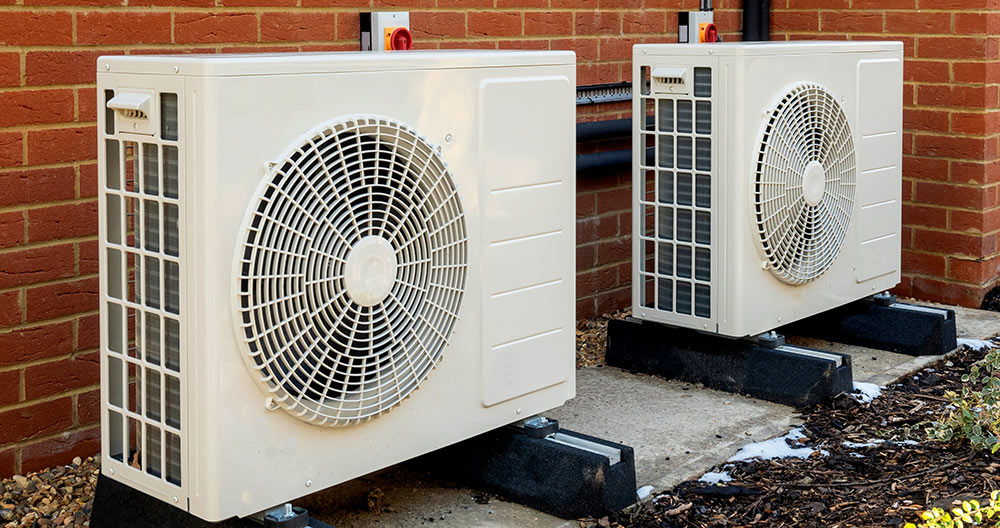 Two Heat Pump Units Outside of Home