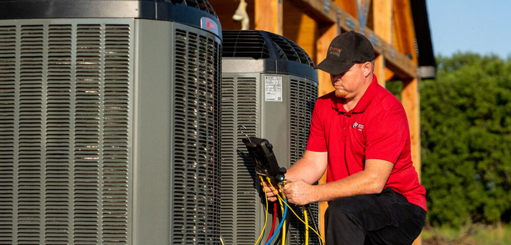 Tech testing AC unit