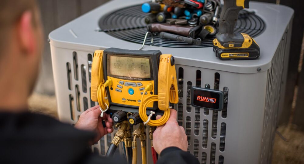 Technician Tuning Up AC Unit